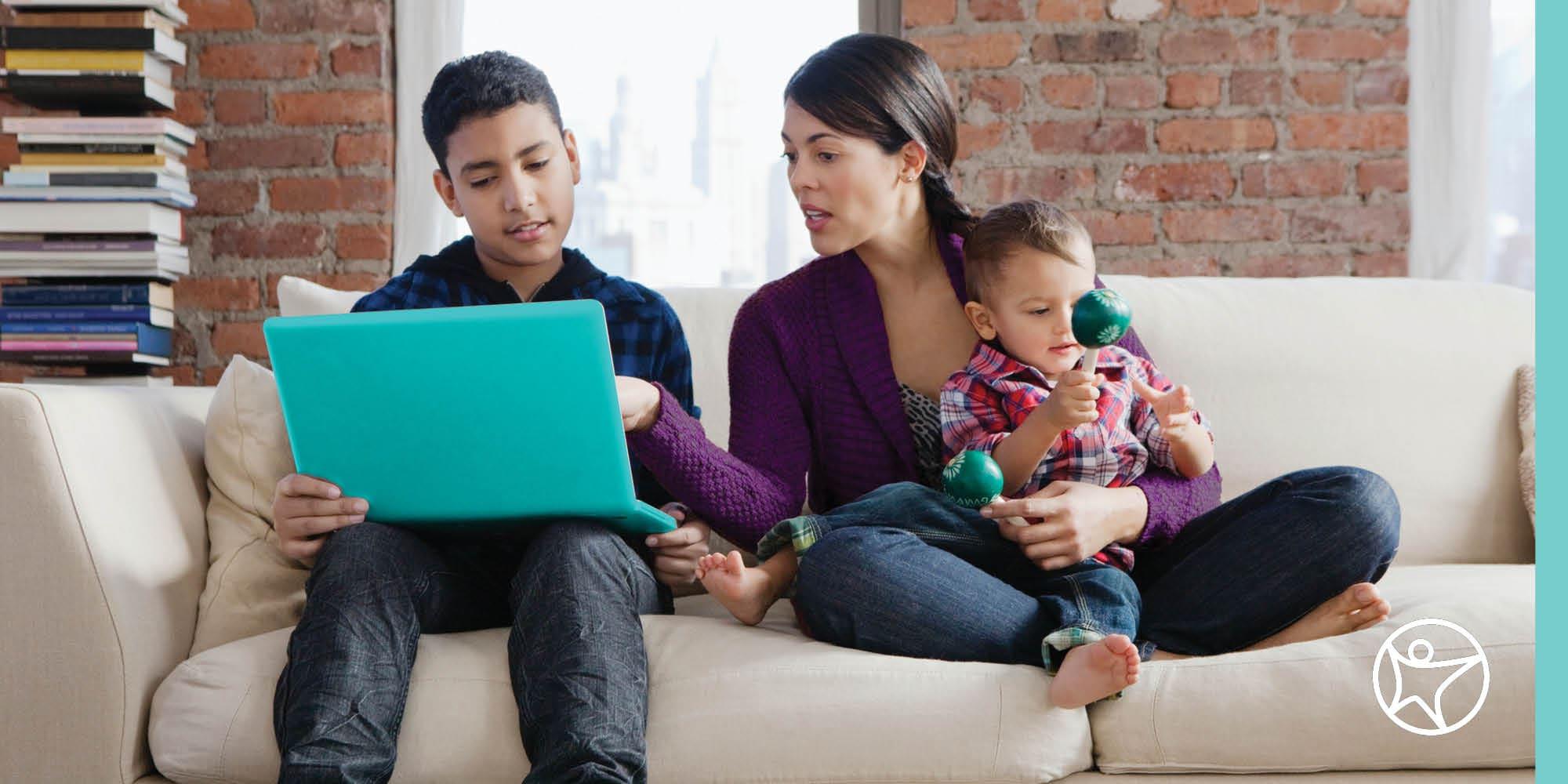 A mother is helping her son with his online classwork